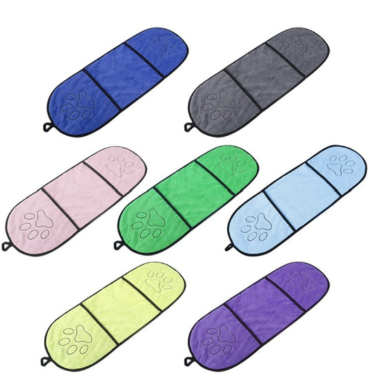 Set of colorful pet towels with paw prints on a white background