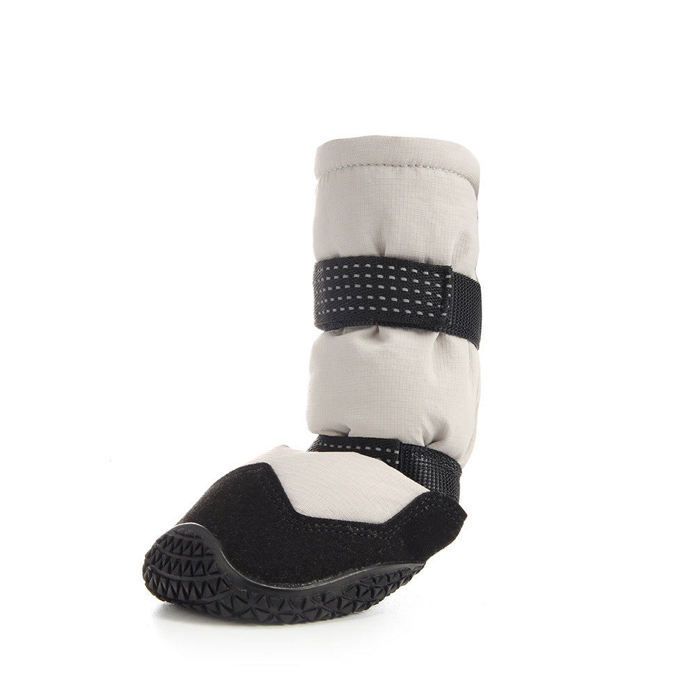 Beige Dog boot with black strap and sole on a white background