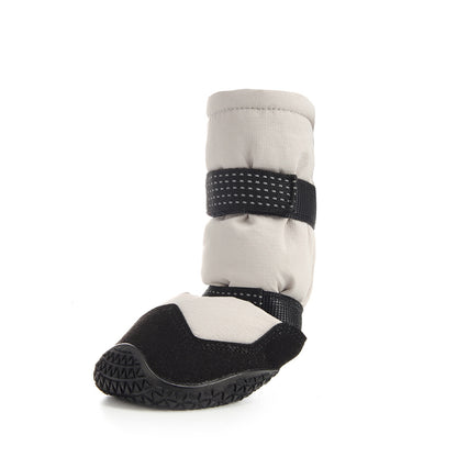 Beige Dog boot with black strap and sole on a white background