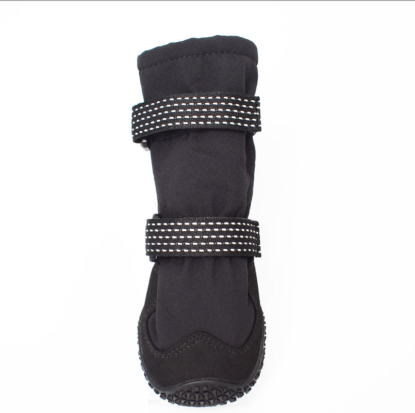 Black dog boot with reflective stitching on a white background
