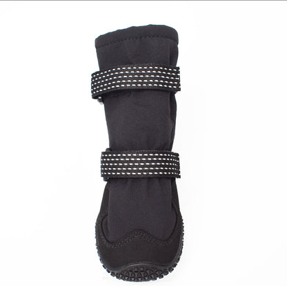 Black dog boot with reflective stitching on a white background