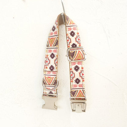 Patterned dog collar with metal clasps on a white background